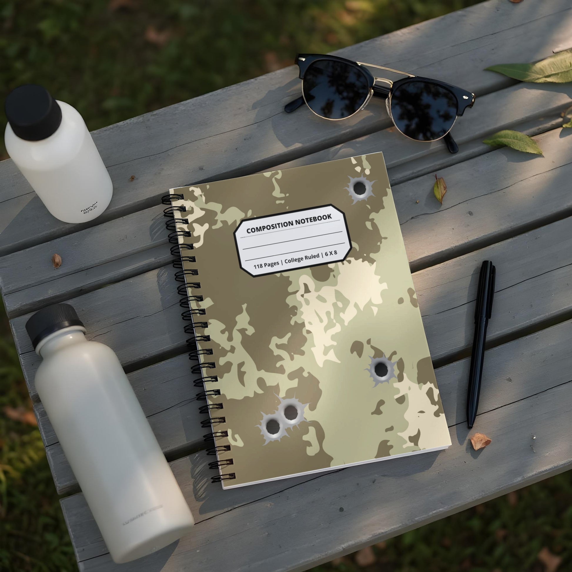 Camouflage composition notebook with bullet holes, 118 pages, 6x8 inches.