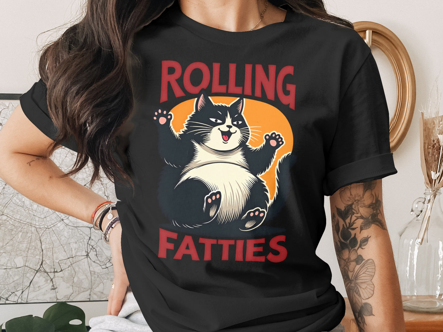 Black t-shirt with a cartoon cat and "ROLLING FATTIES" text.