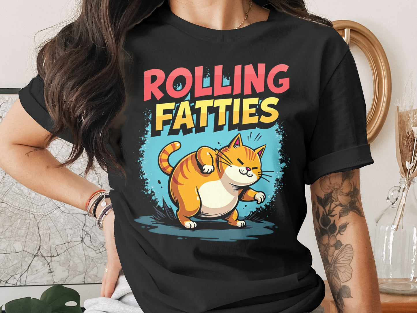 Black t-shirt with cartoon cat and "ROLLING FATTIES" text.