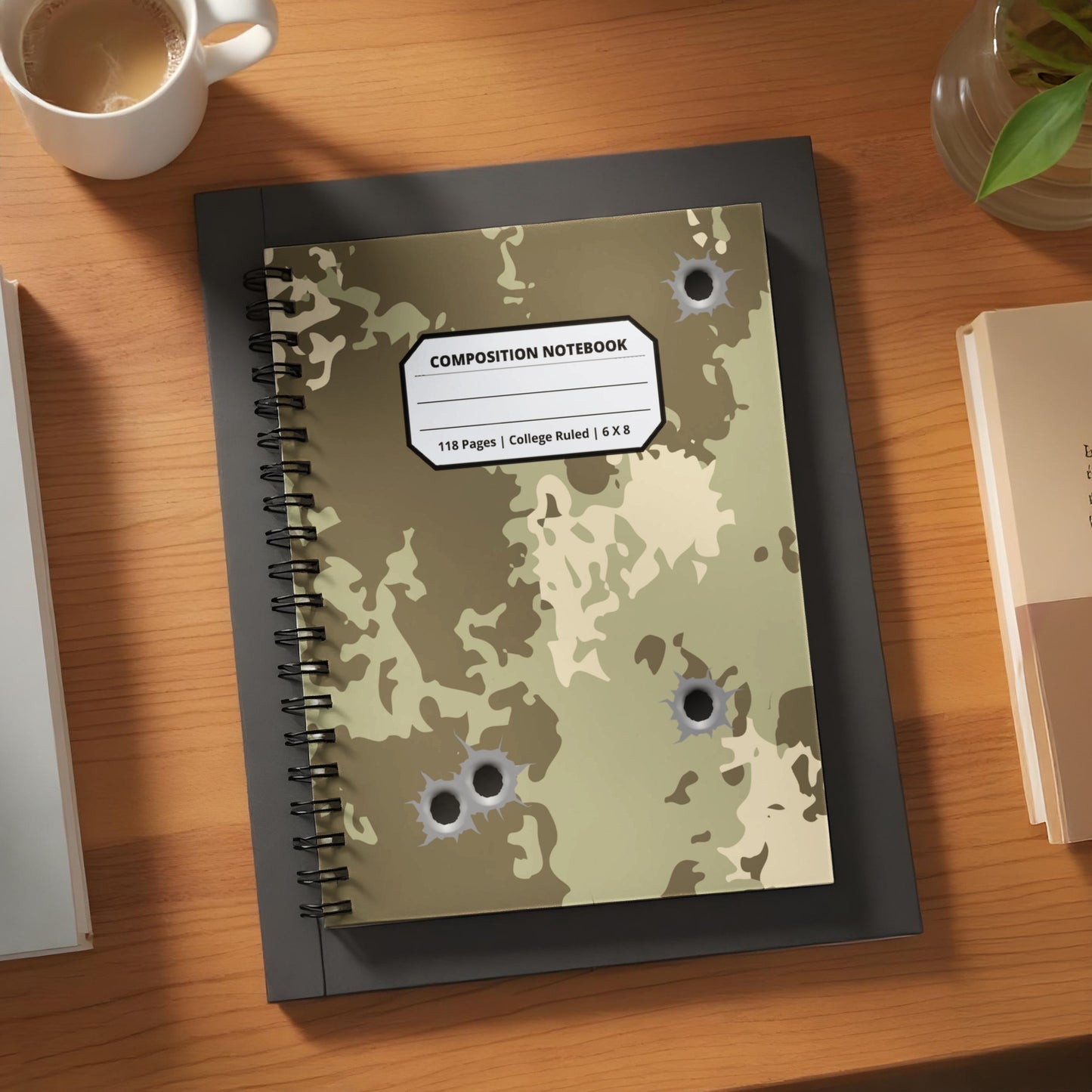 Camouflage composition notebook with bullet hole design.