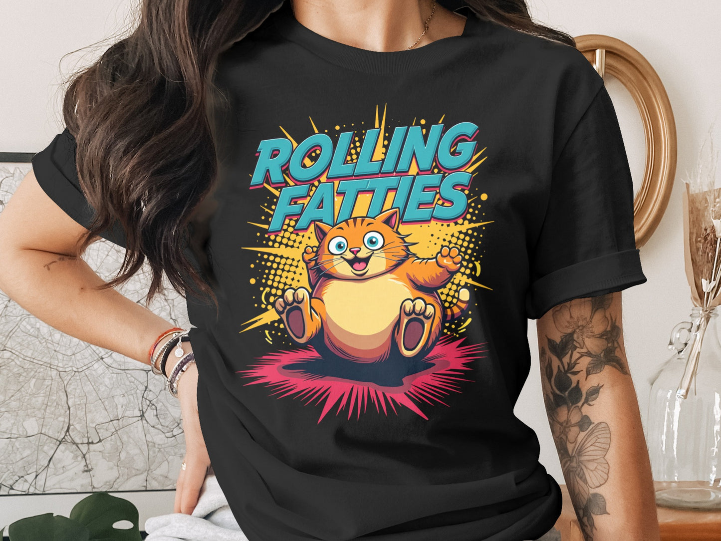 Black t-shirt with cartoon cat saying "Rolling Fatties" in retro font.