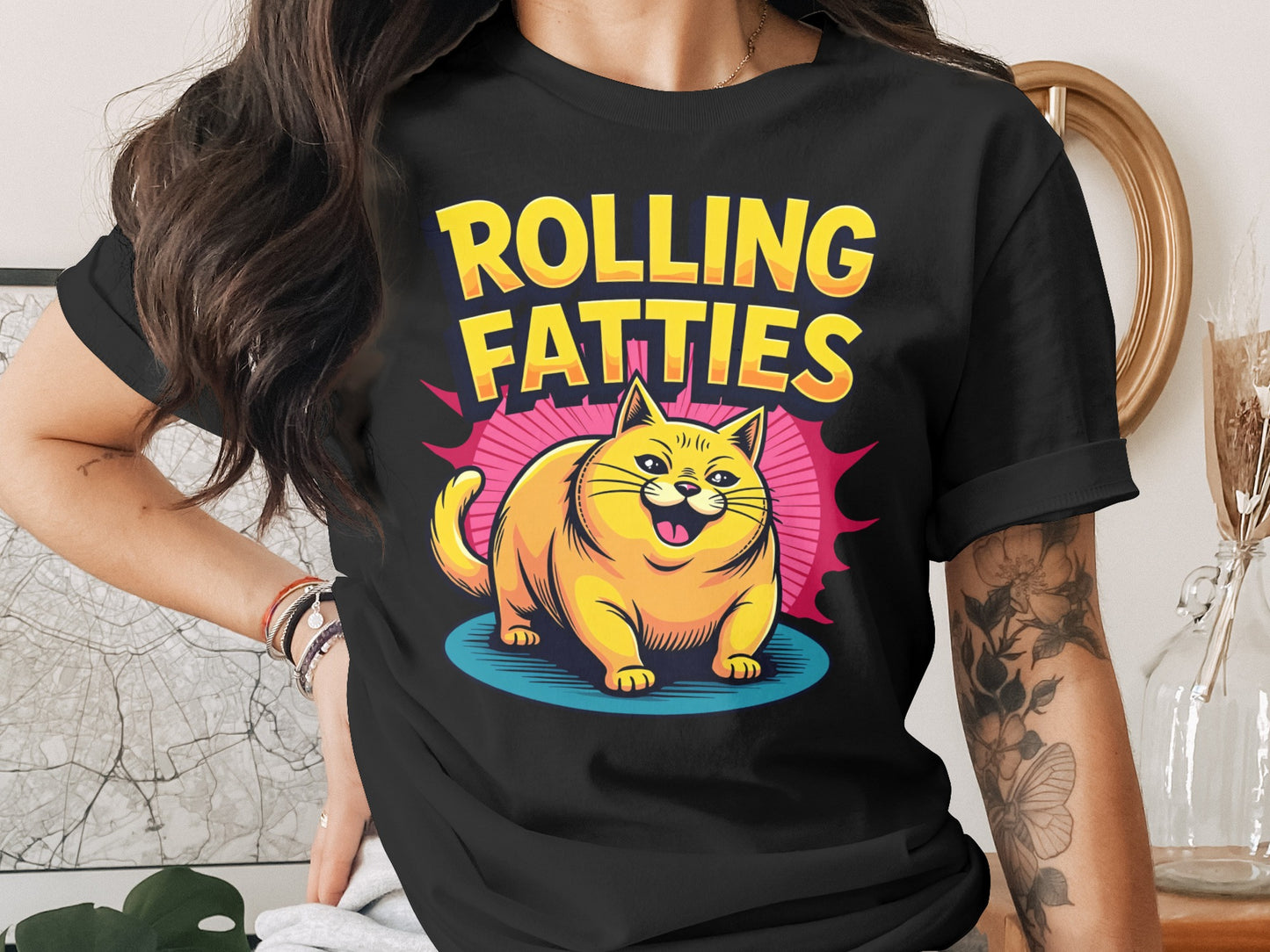 Black t-shirt with yellow cat and "ROLLING FATTIES" text.