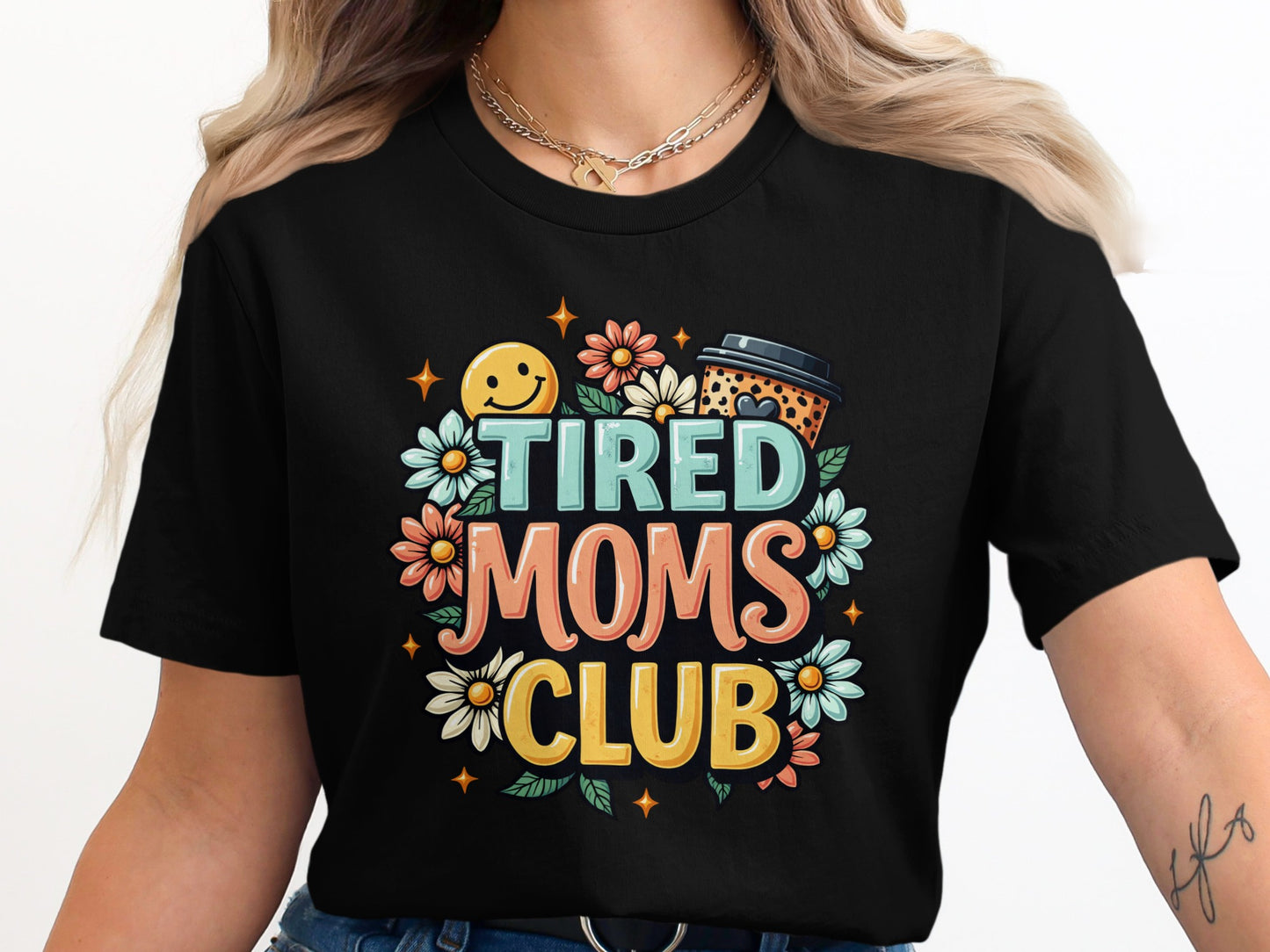 Tired Moms Club graphic with coffee cup, flowers, and smiley face.