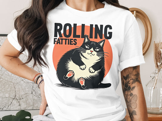 Illustration of a chubby black cat on a white t-shirt, with text "ROLLING FATTIES".