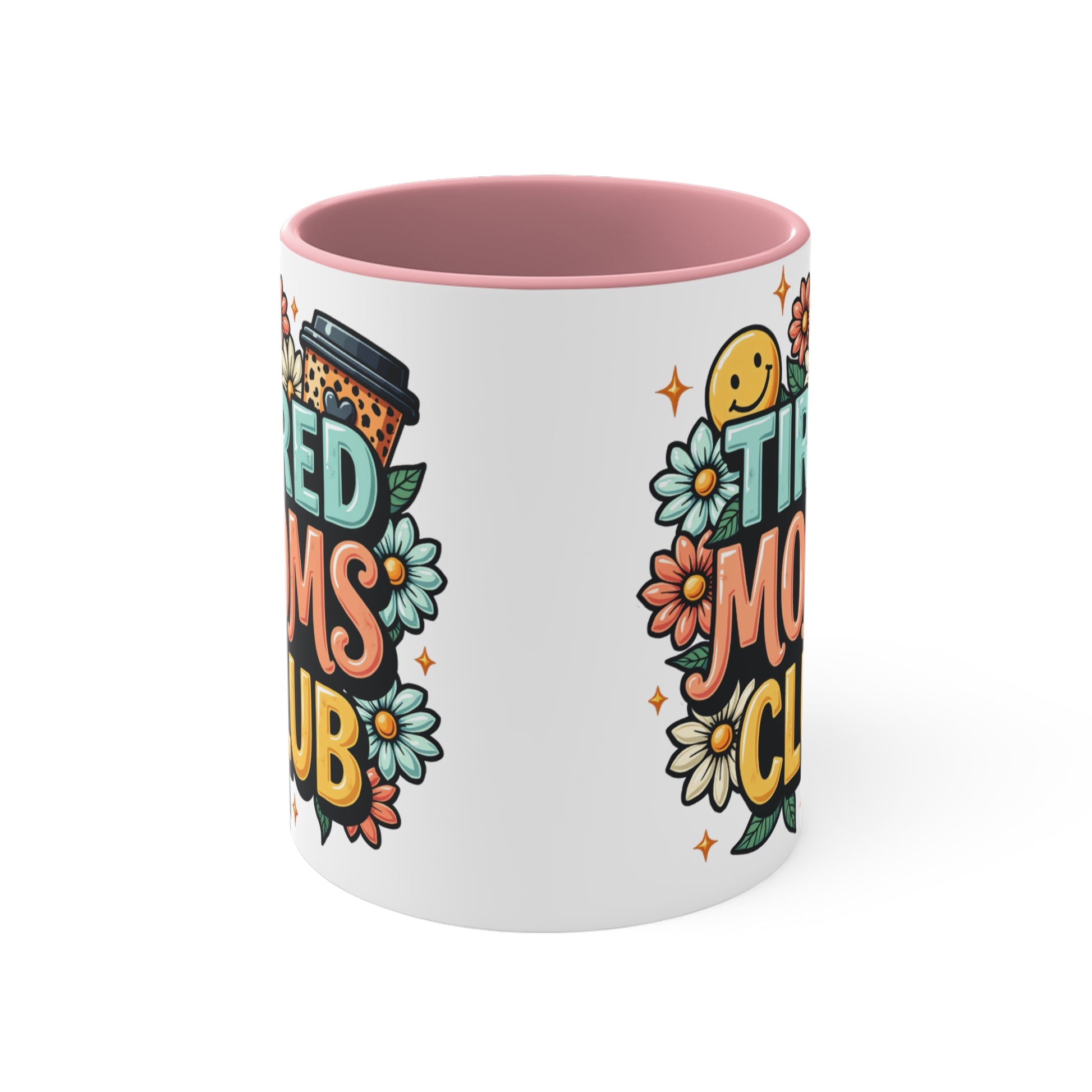 White mug with pink interior, featuring "Tired Moms Club" text and floral designs.